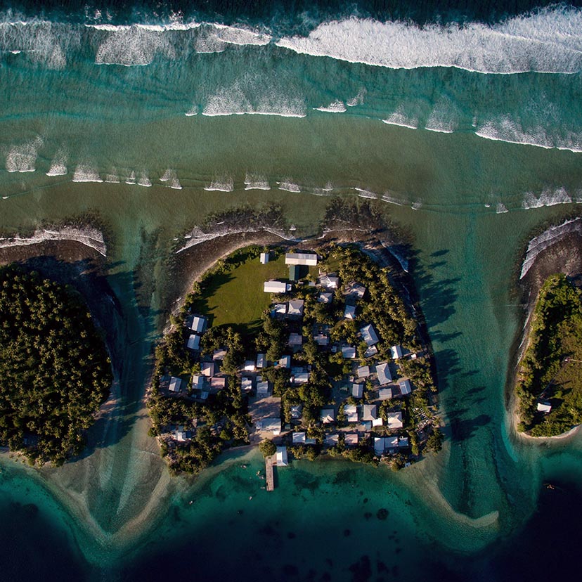 10/29/15 DO NOT PUBLISH WITHOUT TALKING TO DAVID FURST. HOLD FOR FOREIGN DESK STORY BY CORAL DAVENPORT ON SEA LEVEL RISE IN THE MARSHALL ISLANDS. Ejit (center with buildings on it), an islet in the Majuro atoll. The ocean side is at top, and the lagoon side is behind. Ejit is home to past residents of Bikini atoll who were relocated when the U.S. military decided to detonate test nuclear bombs during the Cold War. Now, under threat of further sea level rise, residents of Ejit are looking to move