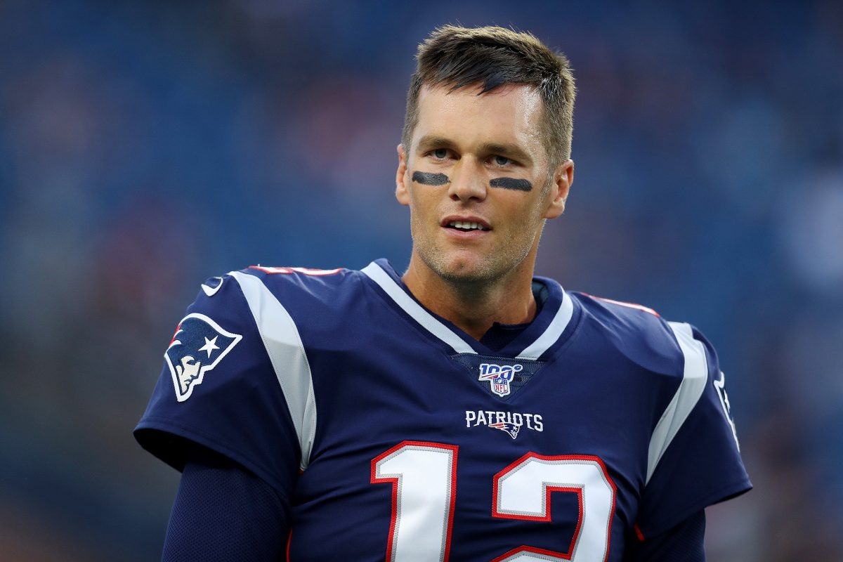 FOXBOROUGH, MASSACHUSETTS – AUGUST 22: Tom Brady #12 of the New England Patriots looks on before the preseason game between the Carolina Panthers and the New England Patriots at Gillette Stadium on August 22, 2019 in Foxborough, Massachusetts. (Photo by Maddie Meyer/Getty Images)