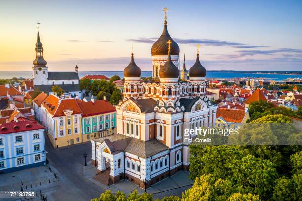 aerial view of Alexander Nevsky cathedral and St Mary’s Cathedral at sunset in Tallinn, Estonia