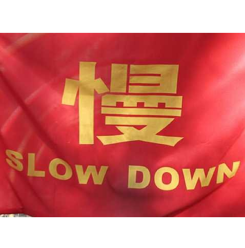 china-slow-down-red-flag-sign